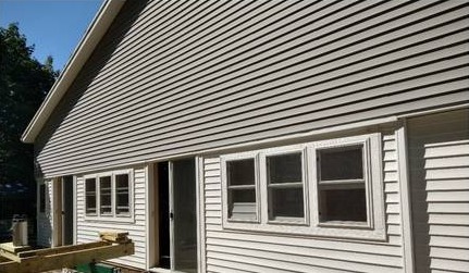 Caledonia, Michigan home with new siding and new windows after installation