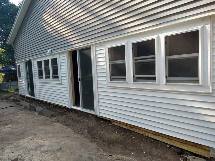 Home exterior with new Alside windows installed by Lopez X Construction
